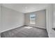 Bright bedroom with carpeted floors and a large window at 549 Viceroy Ct, Kissimmee, FL 34758