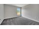 Bedroom featuring bright natural light, neutral colored walls, and plush carpeting at 549 Viceroy Ct, Kissimmee, FL 34758