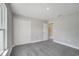 Bright bedroom with a large window, closet, neutral walls, and plush carpeting at 549 Viceroy Ct, Kissimmee, FL 34758