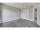Bedroom featuring neutral colored walls, plush carpeting, closet, and door leading to the hallway at 549 Viceroy Ct, Kissimmee, FL 34758