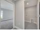 Hallway view leading to a bedroom and the laundry room at 549 Viceroy Ct, Kissimmee, FL 34758