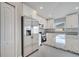 Well-equipped kitchen with stainless steel appliances, granite countertops, white cabinets, and ample counter space at 549 Viceroy Ct, Kissimmee, FL 34758