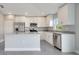 Modern kitchen featuring stainless steel appliances, granite countertops, and a functional island, ideal for cooking at 549 Viceroy Ct, Kissimmee, FL 34758