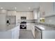 Contemporary kitchen featuring granite counters, stainless appliances, and crisp white cabinetry for a seamless look at 549 Viceroy Ct, Kissimmee, FL 34758