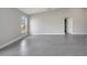 Bright, airy living area showcasing large windows and tile flooring, creating a welcoming and modern ambiance at 549 Viceroy Ct, Kissimmee, FL 34758