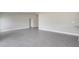 Expansive living area with smooth flooring, leading to additional rooms at 549 Viceroy Ct, Kissimmee, FL 34758