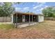 Backyard features a covered patio and lawn at 609 Doheny Way, Casselberry, FL 32707