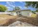 Backyard features a lawn and white fence at 609 Doheny Way, Casselberry, FL 32707