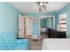 Bright bedroom featuring mirrored closet doors and light colored wood floor at 609 Doheny Way, Casselberry, FL 32707