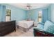Cozy bedroom with a ceiling fan, and a large window at 609 Doheny Way, Casselberry, FL 32707