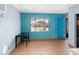 Bonus room with a bright blue accent wall and a large window at 609 Doheny Way, Casselberry, FL 32707