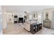Open living area featuring modern flooring, neutral tones, and large windows offering lots of natural light at 609 Doheny Way, Casselberry, FL 32707
