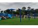 Playground featuring slides, climbing structures, and swings for outdoor fun and recreation at 609 Doheny Way, Casselberry, FL 32707