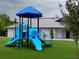 Blue playground with slides and play equipment, set against a backdrop of a restroom building at 609 Doheny Way, Casselberry, FL 32707