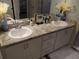 Bathroom featuring a double sink vanity with marble countertops and modern fixtures at 621 Vittorio Dr, Winter Haven, FL 33884