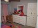 Bright bedroom featuring a full size bed and full size dresser with fun decor at 621 Vittorio Dr, Winter Haven, FL 33884