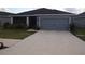 Charming single-story home with a two-car garage and well-maintained front lawn at 621 Vittorio Dr, Winter Haven, FL 33884