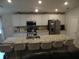 Modern kitchen featuring white cabinets, stainless steel appliances, and a large island with seating at 621 Vittorio Dr, Winter Haven, FL 33884