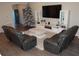 Modern living room featuring a large television, sleek entertainment center, and comfortable seating at 621 Vittorio Dr, Winter Haven, FL 33884