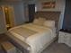 Main bedroom with a large window and a comfortable, cozy bed and decor at 621 Vittorio Dr, Winter Haven, FL 33884