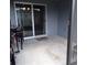 Covered back patio with sliding door entrance to the home's interior at 621 Vittorio Dr, Winter Haven, FL 33884