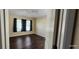 Bright bedroom featuring three windows and laminate floors at 7110 Red Lantern Dr # 23, Harmony, FL 34773
