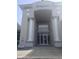 The grand entrance to the community clubhouse, featuring architectural details at 7110 Red Lantern Dr # 23, Harmony, FL 34773