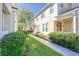 Inviting townhouse exterior with manicured landscaping and a walkway leading to the front door at 7110 Red Lantern Dr # 23, Harmony, FL 34773