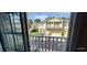 Exterior shot of buildings from balcony, showcasing a well-maintained neighborhood and parking at 7110 Red Lantern Dr # 23, Harmony, FL 34773
