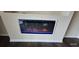 Modern electric fireplace with a sleek design, adding a touch of elegance to the living space at 7110 Red Lantern Dr # 23, Harmony, FL 34773