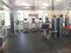 A fully equipped gym with modern cardio machines and weight training equipment at 7110 Red Lantern Dr # 23, Harmony, FL 34773