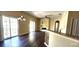 Sun-filled room with stylish laminate flooring, modern lighting, and a sliding glass door at 7110 Red Lantern Dr # 23, Harmony, FL 34773