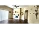 Inviting living room with a stylish electric fireplace, decorative accents, and wood-look flooring at 7110 Red Lantern Dr # 23, Harmony, FL 34773