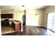 Open-concept space featuring modern kitchen and living area with laminate flooring at 7110 Red Lantern Dr # 23, Harmony, FL 34773
