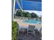 Inviting community pool with poolside seating and lush landscaping at 7110 Red Lantern Dr # 23, Harmony, FL 34773