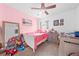 room with pink accents, toys, crib, and a neutral-toned carpet at 739 Jefferson, Davenport, FL 33837