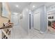 Hallway with neutral paint, tiled floors, interior doors, and wall decorations at 739 Jefferson, Davenport, FL 33837