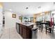 Open kitchen view featuring stainless steel appliances and a breakfast bar with seating at 739 Jefferson, Davenport, FL 33837