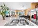 Kitchen island with stainless steel sink, adjacent stainless refrigerator, and open view to living spaces at 739 Jefferson, Davenport, FL 33837