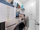 Laundry room with a Samsung washer/dryer set and storage shelves at 739 Jefferson, Davenport, FL 33837