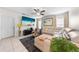 Bright living room with stylish decor, including a sectional sofa and large TV at 739 Jefferson, Davenport, FL 33837