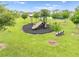 Community playground with slide, swings, and benches at 739 Jefferson, Davenport, FL 33837