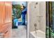 Bathroom with shower-tub combo and door leading to an adjacent themed bedroom at 7458 Gathering Dr, Kissimmee, FL 34747