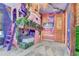 Unique themed bedroom featuring a custom bunk bed adorned with floral accents and a muraled wall at 7458 Gathering Dr, Kissimmee, FL 34747
