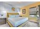 Bright bedroom featuring a king bed, whimsical cloud lighting, and light walls that create a relaxing atmosphere at 7458 Gathering Dr, Kissimmee, FL 34747