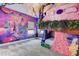 Bedroom featuring a custom mural, overhead botanicals, and lofted custom bunkbeds with flower accents at 7458 Gathering Dr, Kissimmee, FL 34747