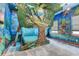 Whimsical bedroom with a unique tree-themed bed and colorful wall art at 7458 Gathering Dr, Kissimmee, FL 34747