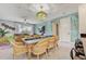 Bright and spacious dining area connected to the living room, featuring a large table and comfortable seating at 7458 Gathering Dr, Kissimmee, FL 34747