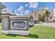 Elegant resort entrance showcasing a stately sign, manicured lawn, and the resort buildings in the background at 7458 Gathering Dr, Kissimmee, FL 34747