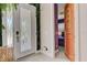 Bright entryway with decorative door and leafy decor and views to bedroom at 7458 Gathering Dr, Kissimmee, FL 34747